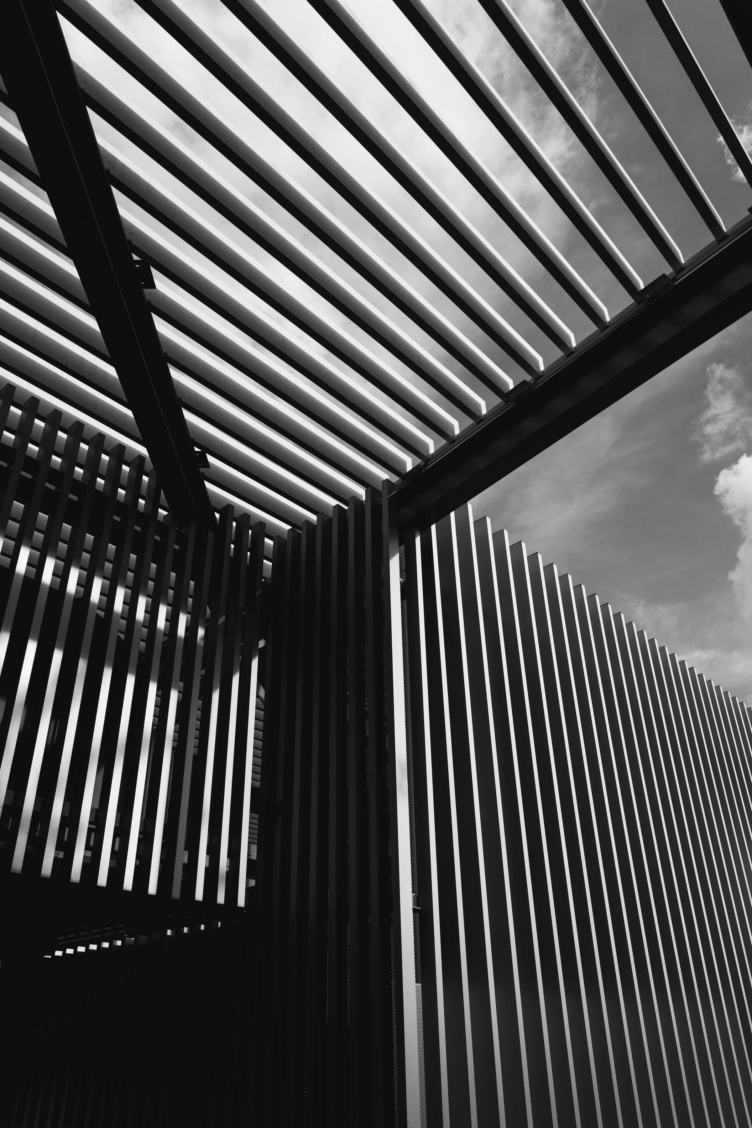 Pergola beams cutting across an open sky