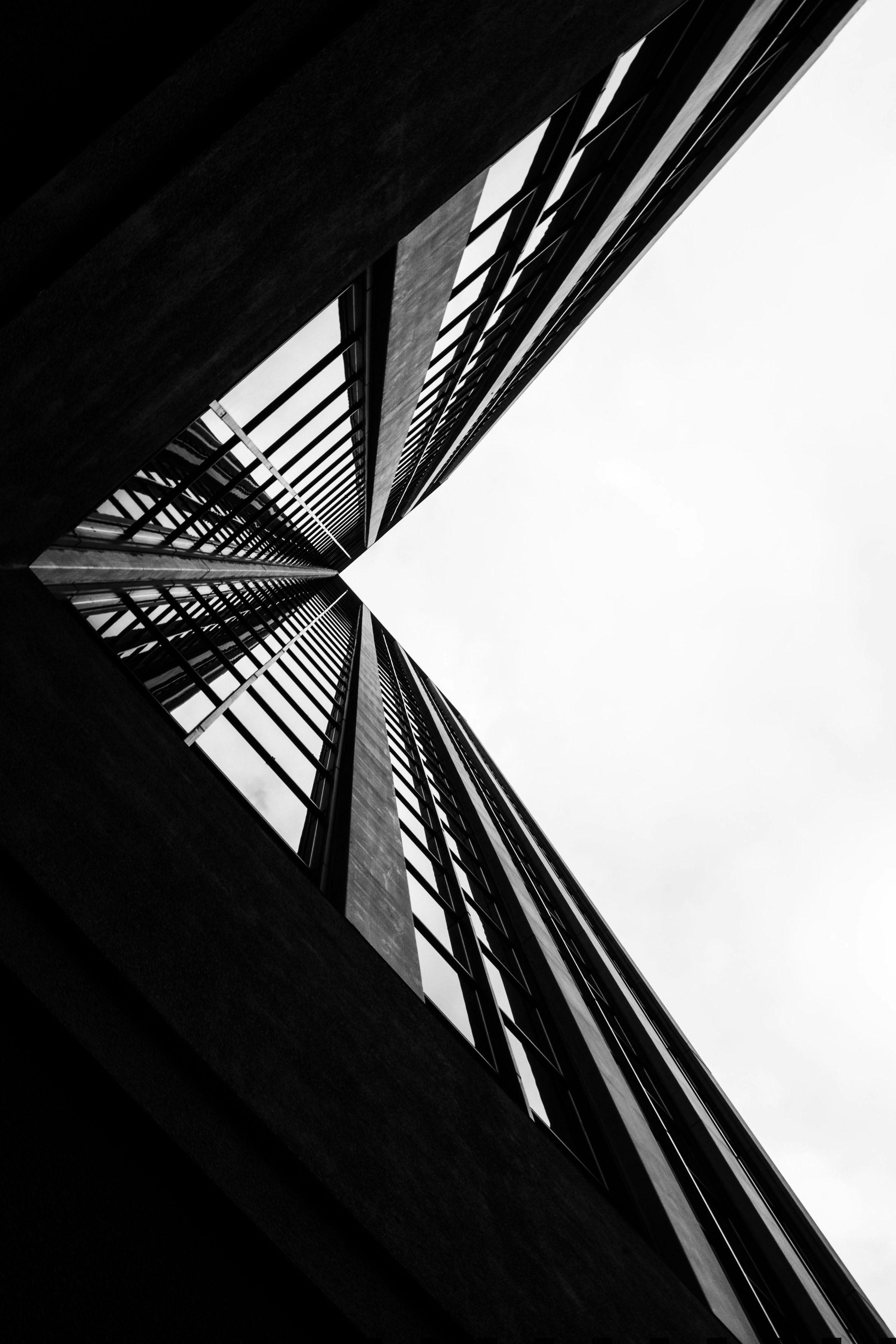 Looking up through a narrow atrium toward the light