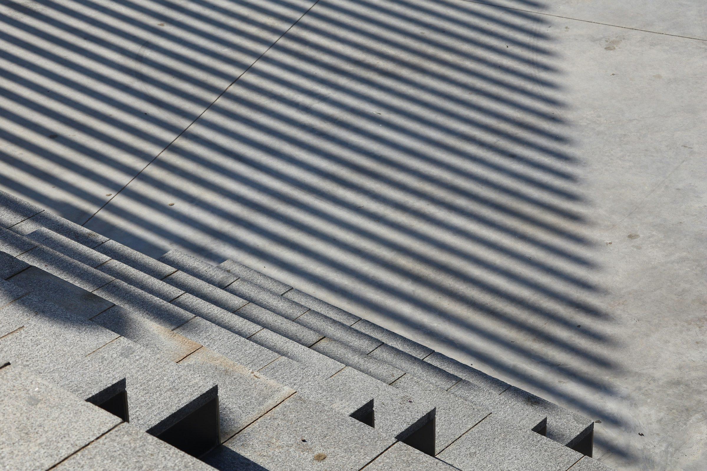 Stair treads striped by strong daylight