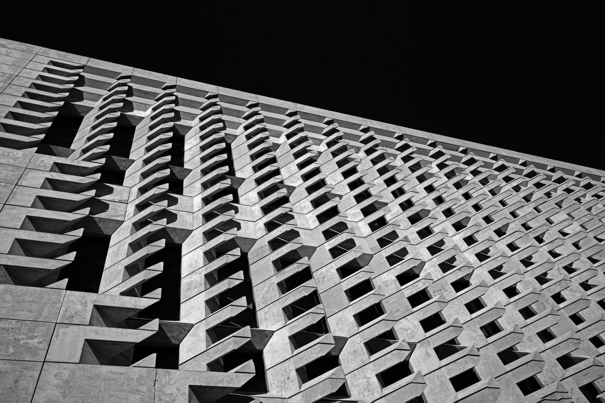 A patterned façade receding in perspective